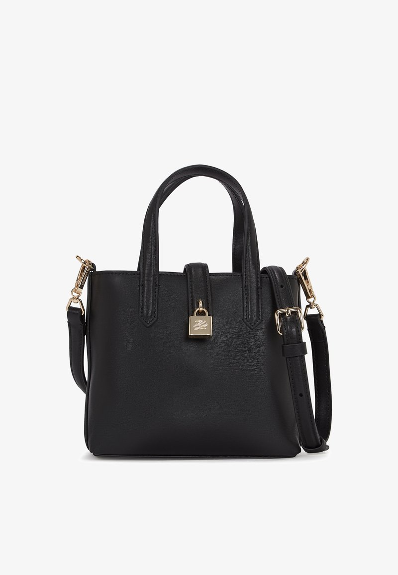 Sac à main en cuir noir avec deux poignées courtes, une bandoulière amovible et un accent de cadenas en ton doré sur le devant. Texture lisse.