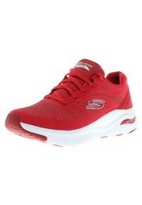 Red athletic shoe with mesh upper, lace-up design, white sole, textured pattern, and "Arch Fit" branding on the side.