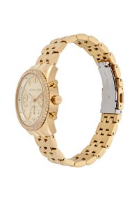 Montre chronographe en acier inoxydable doré avec un bracelet texturé, un cadran rond, trois sous-cadrans et une lunette ornée de cristaux.