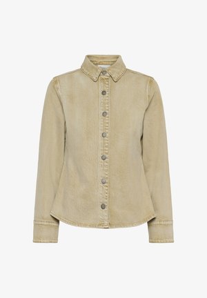 Gaiši bēša džinsa virsjaka ar garām piedurknēm, smailu apkakli un metāla spiedpogas priekšpusē, nedaudz pieguļoša vidukļa daļā.