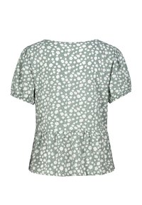 Grüne Blumenbluse mit kurzen Puffärmeln, ausgestattet mit einem Peplum-Saum und verstreuten weißen und rosa Blumenmustern auf einem hellen Hintergrund.