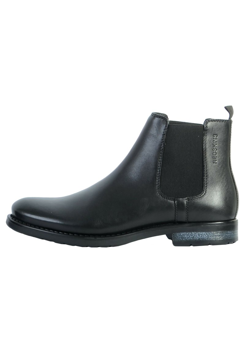 Stivale chelsea in pelle nera con pannelli laterali elasticizzati, punta rotonda e suola testurizzata. Presenta un logo sottile sul tallone.