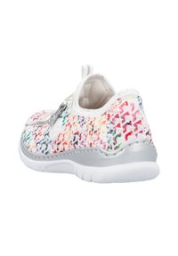 Multicolored fabric sneaker with a textured pattern, elastic lace, silver accents, and a cushioned sole. Low-profile design.