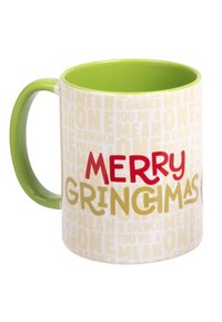 Tazza di ceramica con un manico e un interno verdi. Presenta un esterno bianco con testo ripetuto e la scritta "MERRY GRINCIMAS" in rosso e oro in grassetto.