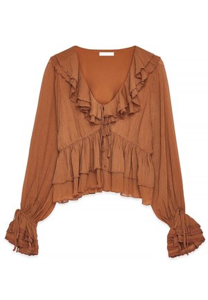 Blouse marron à manches longues avec encolure en V à volants, ourlet à volants superposés et poignets froncés noués avec des nœuds.