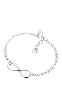 Silver armband med en länkad kedjedesign. Har ett oändlighetssymbol i mitten, accentuerad med en liten, klar ädelsten.