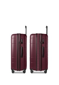 Two maroon hard-shell suitcases with black handles, four wheels, and extended telescopic handles shown side by side, one expanded and one closed.