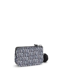 Gevoerd muntzakje in zwart-wit zebra patroon, met een zachte zwarte pompon als accent. Gemaakt van duurzaam fabricaat, compact rechthoekig van vorm.