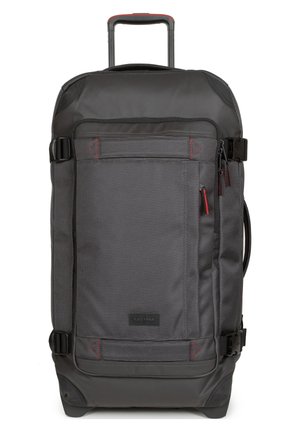 Wheeled backpack in black and gray textured fabric, featuring a retractable handle, multiple zippers, and red accents. Compact design with side pockets.