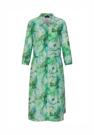 Robe boutonnée à manches longues vertes et blanches avec col, ornée d'un imprimé botanique feuillu et d'une jupe mi-longue.