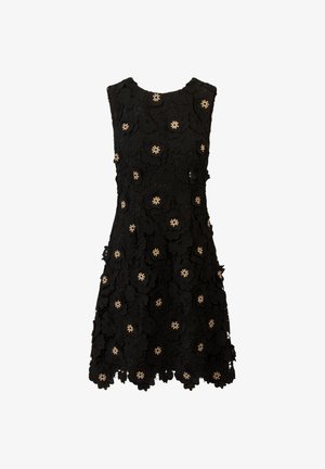 Zwarte mouwloze jurk van kant, met bloemmotieven versierd met kralen. De golvende zoom voegt detail toe aan het ontwerp.