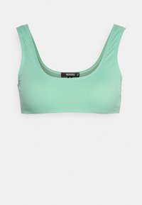 Bralette em verde menta com costelas, com decote redondo e alças largas. Apresenta um design simples e uma etiqueta com logótipo ao centro.