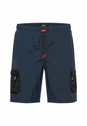 Mørkeblå shorts med struktureret overflade, der har rød snor i taljen, sidelommer i mesh og lynlåsdetaljer til opbevaring.