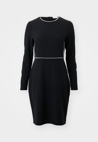 Μαύρο φόρεμ�α με μακριά μανίκια και στρογγυλή λαιμόκοψη, με λευκή επένδυση στη μέση και στον γιακά. Κατασκευασμένο από ομαλό, ελαστικό ύφασμα.