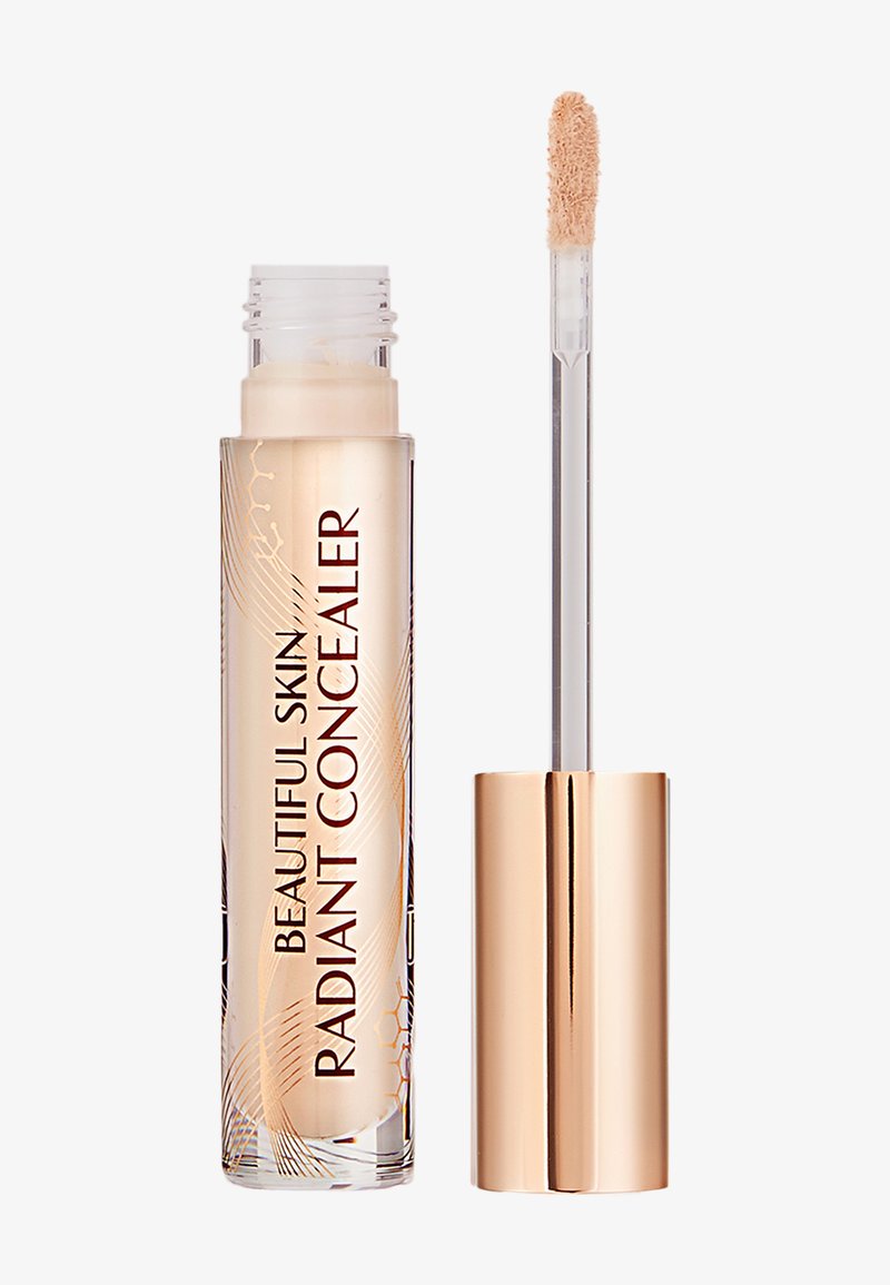 Concealer tube labeled "Beautiful Skin Radiant Concealer" with a gold cap and applicator wand showing beige creamy product.