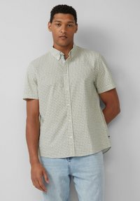 Kurze Baumwollbluse in Hellgrün mit einem Karomuster aus dunkelblaue Quadraten, ausgestattet mit klassischem Kragen und weichem Stoff.