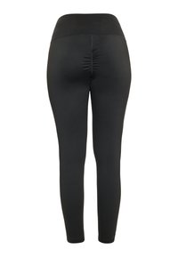 Mustat leggingsit korkealla vyötäröllä, takana kokoontumisdetalji ja sileä, joustava kangas mukavuutta ja liikkuvuutta varten.