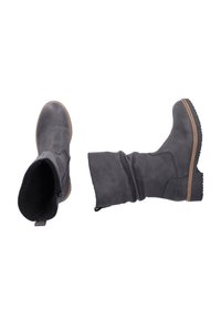 Bottes en cuir gris avec un design décontracté, fermeture éclair et semelle en caoutchouc texturée. Elles présentent une doublure intérieure douce et une poignée à l'arrière.