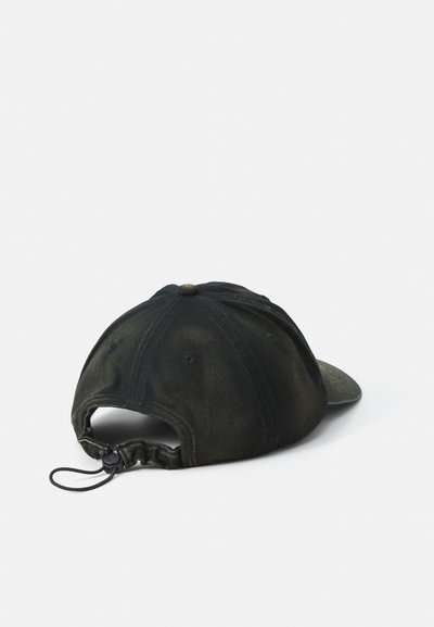 Baseball cap in dark green and black denim with a textured finish, curved brim, and adjustable strap at the back.