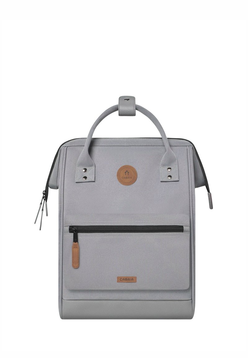 Gray backpack made of durable fabric with a rectangular shape, front zip pocket, leather accents, and top handle for carrying.