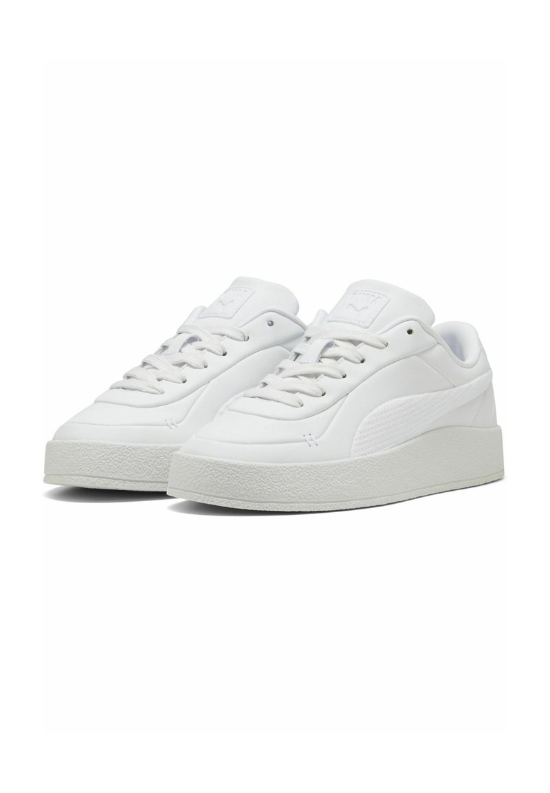 White sneakers with a smooth synthetic upper, textured side panel, and a thick rubber sole. Features laces and padded tongue for comfort.