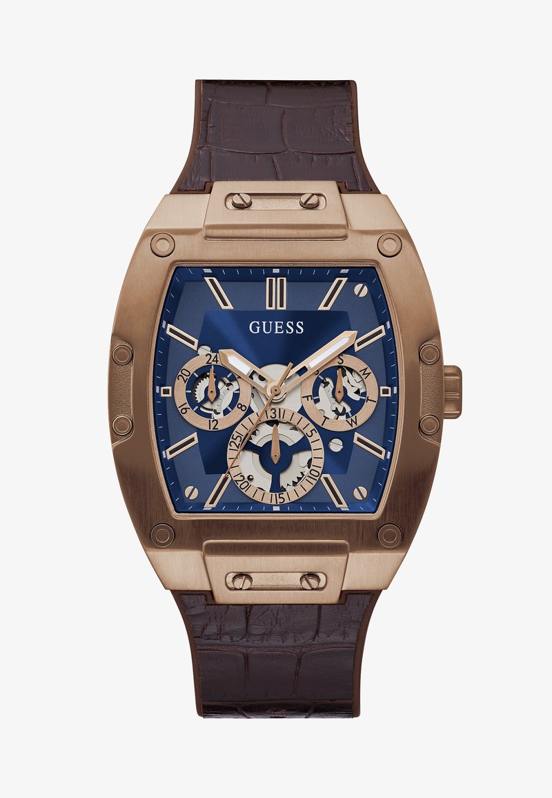 Montre carrée en bronze avec un cadran bleu, trois sous-cadrans, marquages blancs, bracelet en cuir texturé marron et détails matériels accentués.