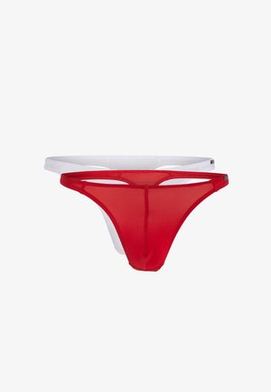 Perizoma rosso e bianco realizzato in tessuto morbido e trasparente. Presenta spalline strette e un design minimalista con una finitura texturizzata.