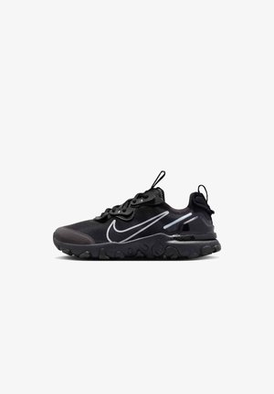 Black athletic shoe with a mesh upper, textured rubber sole, reflective accents, and a distinct Nike swoosh logo. Lightweight and breathable design.