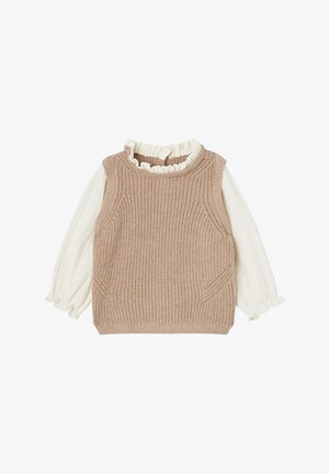 Beige knitted sleeveless vest layered over long-sleeve white blouse with ruffled collar and cuffs, displayed flat on a white background.