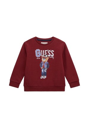 Felpa bordeaux con maniche lunghe, polsini e scollatura a coste; presenta una grafica di un orso che indossa un giubbotto, accompagnata dal testo "GUESS".