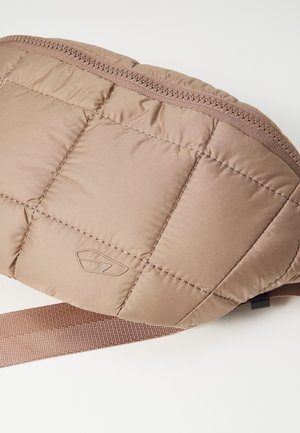Light brown quilted fabric waist bag with zipper closure and adjustable strap on a white background.