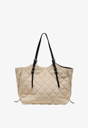 Beige quiltet tote-taske med to sorte justerbare skulderremme og sidelommer med lynlåsdetaljer.