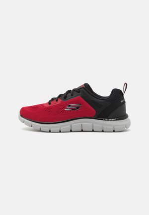 Red and black athletic shoe with a mesh upper, textured detailing, and a lightweight white sole. Features a pull tab and logo accent.