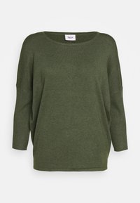 Överdimensionerad, olivgrön tröja i mjukt stickat material. Har en bred halsringning, sänkta axelsömmar och ribbade ärmslut för textur.