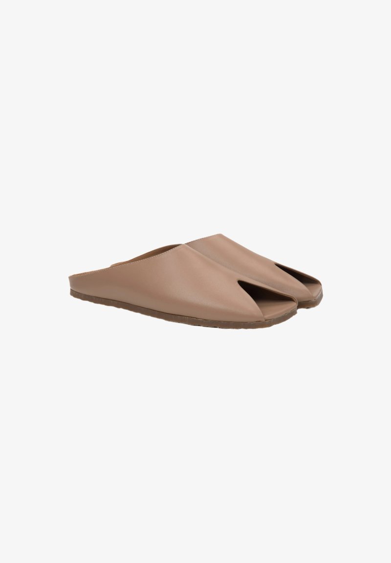 Open-toed slip-on slippers made of soft beige material with a simple design, featuring a flat rubber sole for comfort.