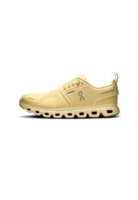 Light yellow running shoe with a textured mesh upper, rounded toe, and cushioned sole featuring distinct cutouts and a rear pull tab.