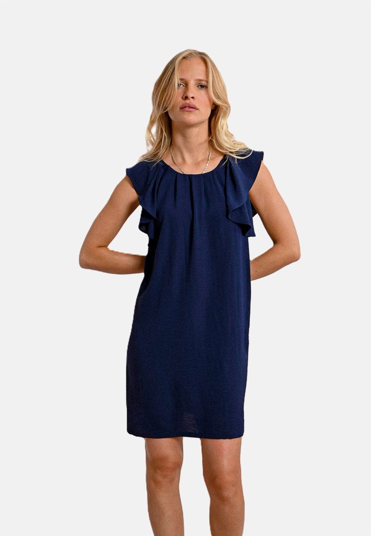 Vestito blu navy realizzato in tessuto leggero, con maniche a sbuffo e una vestibilità rilassata, che si ferma appena sopra le ginocchia.