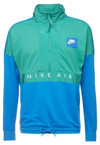 Nike Air pullover i grön och blå. Har design med halvdragkedja, ståkrage, elastisk midja och logotyp på bröstet. Slät textur.