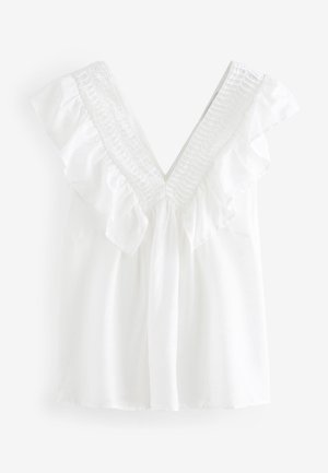 Biała bawełniana bluzka z dekoltem w serek i falbaniastymi rękawami. Charakteryzuje się marszczeniem wzdłuż dekoltu oraz miękką, gładką teksturą.