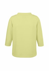 Geel, langemouwen shirt met een kraag en een gestructureerde katoenen stof, met een rechte zoom en geen zichtbare logo's of patronen.
