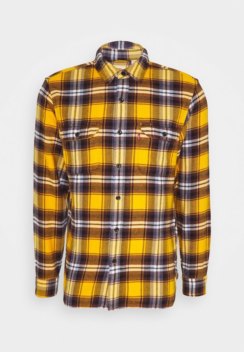 Chemise à manches longues pour homme, à carreaux jaune, brun et blanc, à boutons, avec deux poches poitrine et un col.
