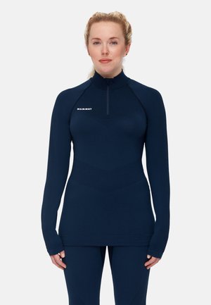 Marinefarbener Langarm-Reißverschlussoberteil mit hohem Kragen, das ein schlankes, tailliertes Design und strukturierten Stoff aufweist. Mit einem dezenten Logo auf der Brust.
