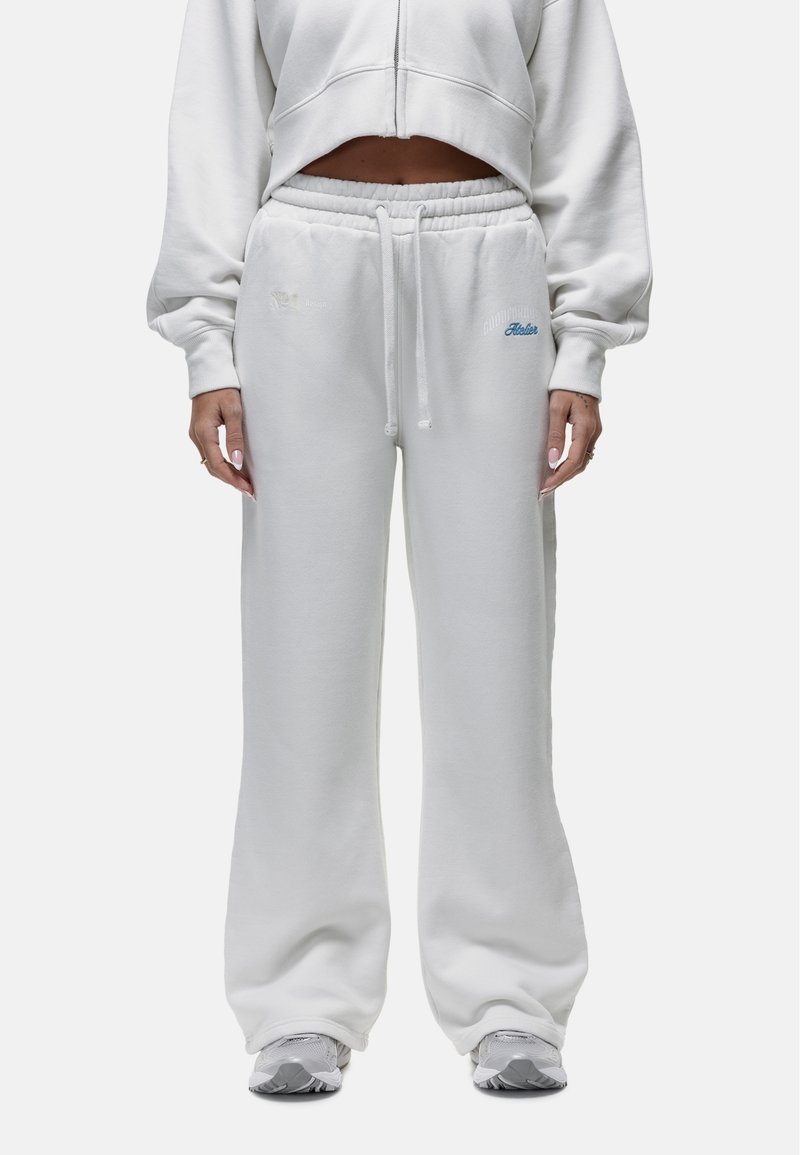 Witte katoenen sweatpants met een relaxte pasvorm, elastische tailleband en verstelbare koord. Kenmerkt subtiele blauwe logo-geborduurde details aan de zijkant.