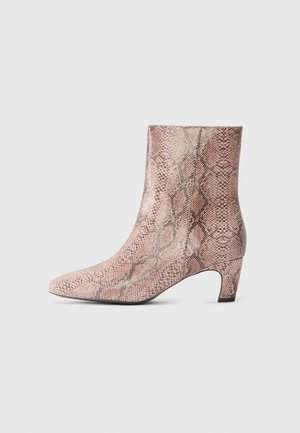 Ankle-high women's boot with low heel, pointed toe, and pink snake skin pattern, shown in side profile on a white background.