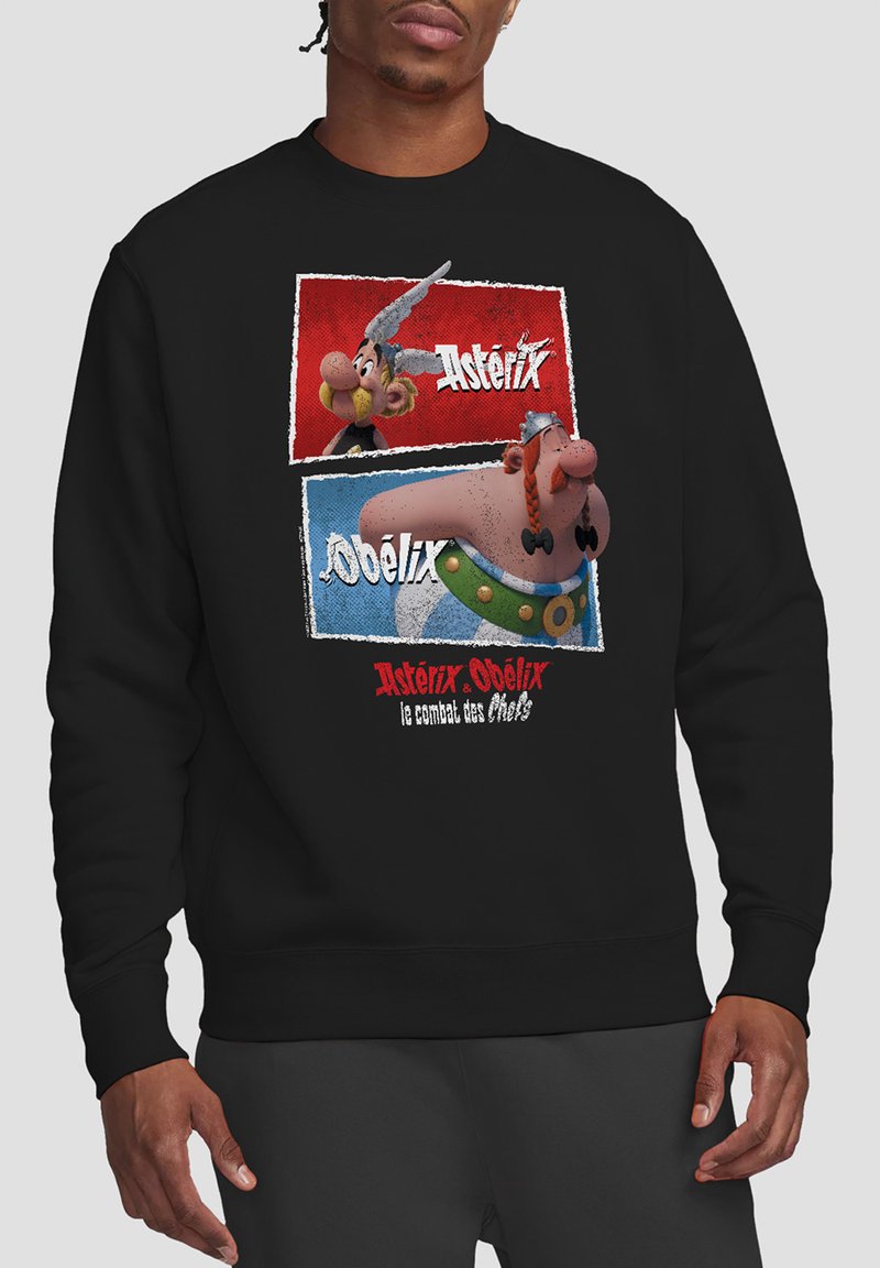 Black sweatshirt featuring a graphic of Asterix and Obelix on a printed background with red and blue panels, text in white and red.