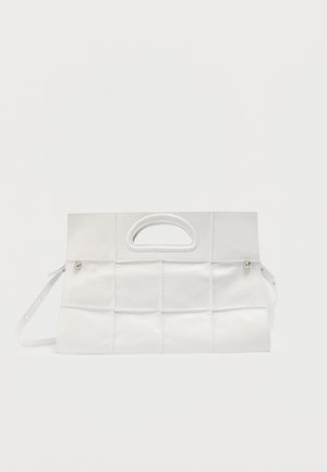 White rectangular handbag with a woven leather pattern, cut-out handle at the top, and detachable shoulder strap on a plain background.