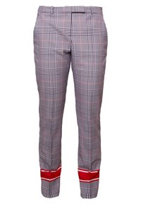 Pantaloni a quadri con un motivo nero, bianco e rosso, caratterizzati da una vestibilità slim e strisce rosse sugli orli. Realizzati in tessuto intrecciato.