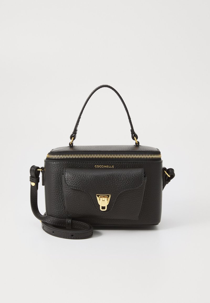 Black leather handbag with a structured design, gold hardware, top handle, detachable shoulder strap, and a front pocket with a clasp.