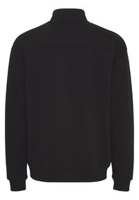Sort sweatshirt med høj krave, lange ærmer og ribbede manchetter. Glat overflade med minimal syning detalje bagpå.