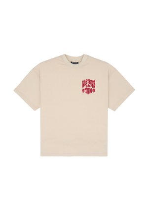 Beige cotton t-shirt with a loose fit, round neckline, and a red graphic print reading "WESTRIVALS STUDIO" on the left chest area.